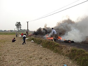Fig.1. Open burning of electrical cables to recover copper wires at footpaths in rice paddies